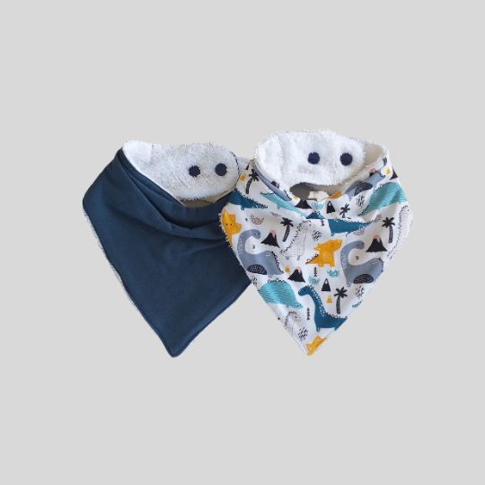 Front views of the Dark Teal and Blue Dinosaurs Dribble Bibs