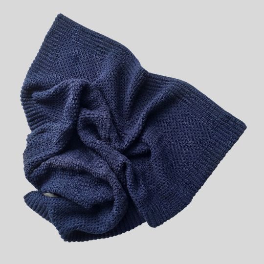 Thrown flat view of the Navy Merino Stroller Blanket