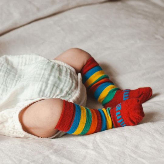 Baby lying on its back wearing Scooter Knee High Socks